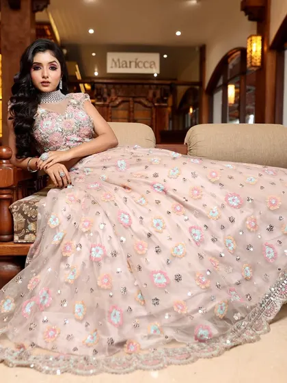 Glam, grace, and elegance. This bride looks like she's stepped out of a magazine, with her stunning pastel lehenga and flawless makeup.