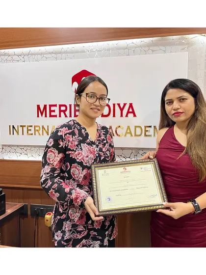 Celebrating the achievement of another graduate, who is now ready to serve clients professionally.
