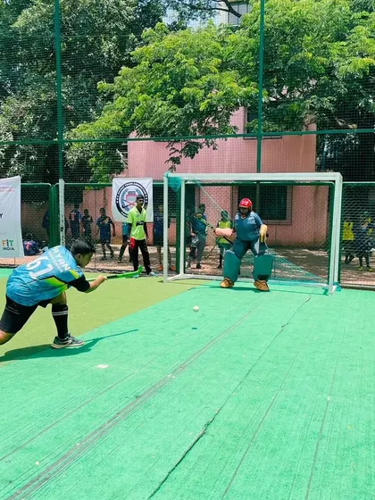 A junior player takes a shot on goal during the Olympic Day event. It's a great platform for young players to experience a bit of competitive pressure in a supportive setting.