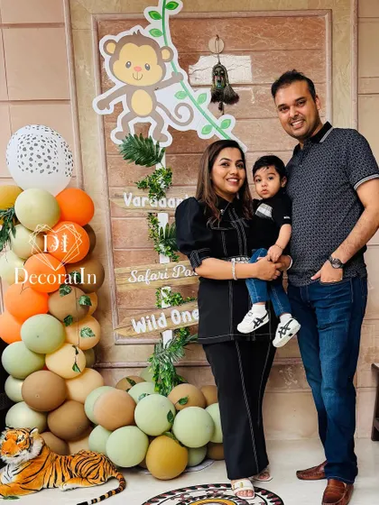 Another family photo by the safari party welcome sign, complete with a friendly tiger prop.