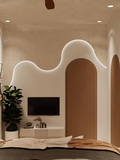 The wavy, illuminated wall panel also serves as the backdrop for the TV unit, blending form and function seamlessly.