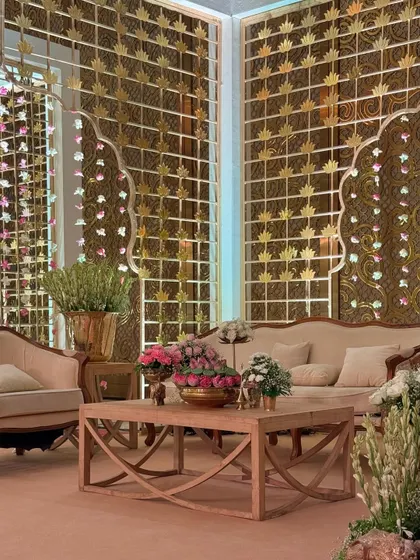 Another view of the plush seating area, where modern wooden furniture is paired with traditional golden backdrops, creating a unique fusion of styles.