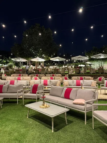 Another perspective of the comfortable and stylish lounge seating arranged on the amphitheater lawns, ready for guests to enjoy an evening celebration.