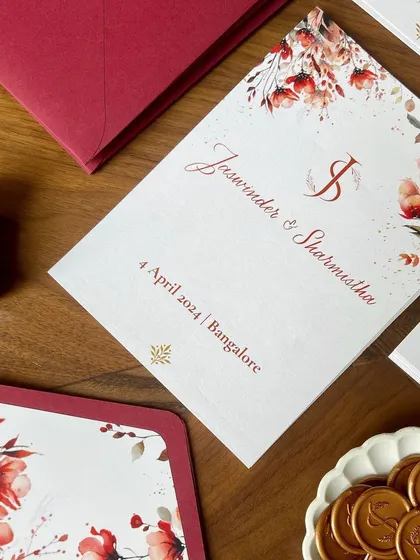 A closer look at the details from this beautiful wedding suite. The design included multiple inserts with event details, custom floral envelope liners, and a personalized wax seal with the couple's initials.