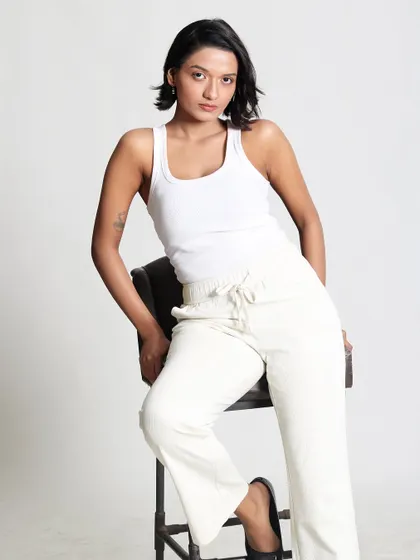 This full length shot shows how a minimal makeup look can be incredibly versatile. It is clean, confident, and allows the person's natural presence to shine through.