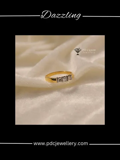 A dazzling three-stone diamond ring for men, set in 18kt hallmarked gold. This is a classic, masculine design that is both stylish and timeless.