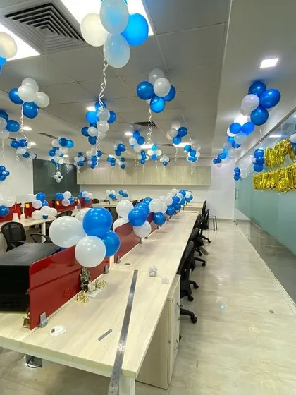 Another angle of the office inauguration decoration, showing the balloon arrangements on each desk.