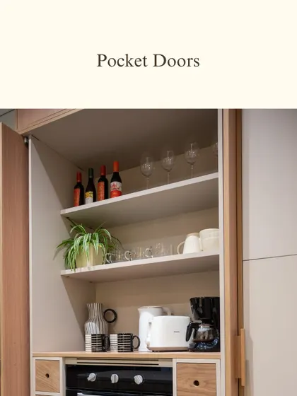 Pocket doors are a wonderfully practical solution for creating an appliance station. They keep your daily essentials hidden when not in use, helping to maintain a minimalist and uncluttered kitchen environment.