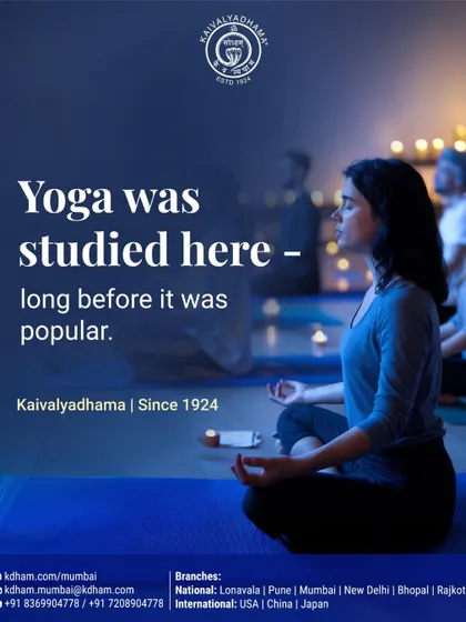 A woman meditating in a candlelit room. Since 1924, long before yoga became a global trend, we have been dedicated to its scientific study. This legacy of research ensures that our practices remain authentic, responsible, and deeply rooted in a century of understanding.