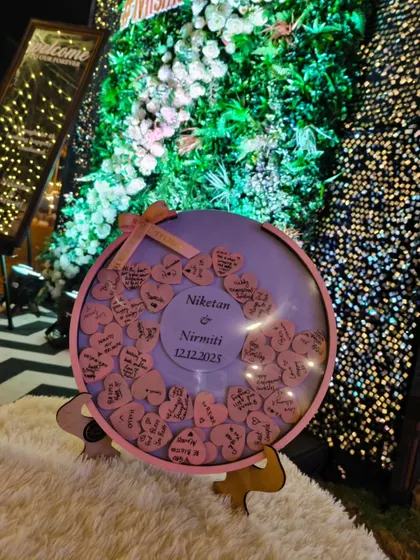 The wish board on display at the venue, surrounded by beautiful floral and light decorations. It was a stunning focal point for the event.
