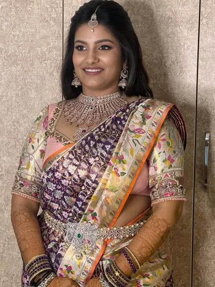 This bride looks radiant and happy. The soft makeup and half-up hairstyle create a look that is both modern and timeless.