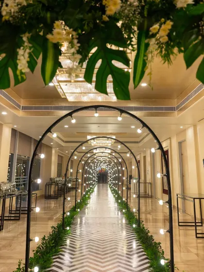 I designed this stunning arched tunnel of lights to create a grand and dramatic entrance for the Sangeet ceremony. It guided guests into the main event space, building anticipation with every step.