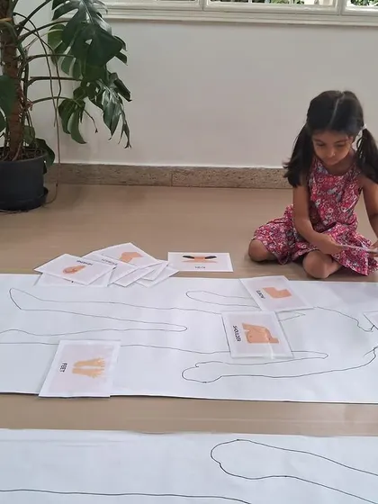 Our kindergarteners explore the human body by matching organ cards to a life-sized outline of their own bodies.