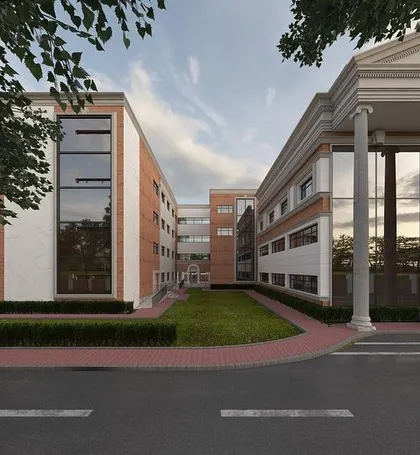 A perspective of the school building, showing the relationship between the classical main entrance and the more modern adjoining wings. The design balances tradition with contemporary needs.