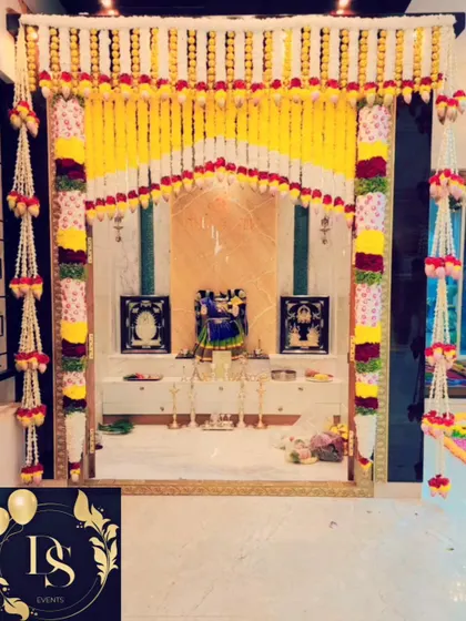 I also provide decorations for your home's pooja room. This setup features intricate floral garlands made of jasmine, roses, and chrysanthemums, designed to beautifully frame the sacred space for a housewarming or festival.