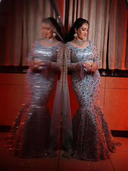 My client Supriya looks absolutely breathtaking in this custom powder blue fish-cut lehenga for her reception. The all-over sequin and bead work is simply stunning.