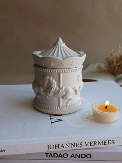 The carousel horse jar is such a nostalgic and charming piece. It's crafted from eco-resin and is a beautiful decorative object on its own.