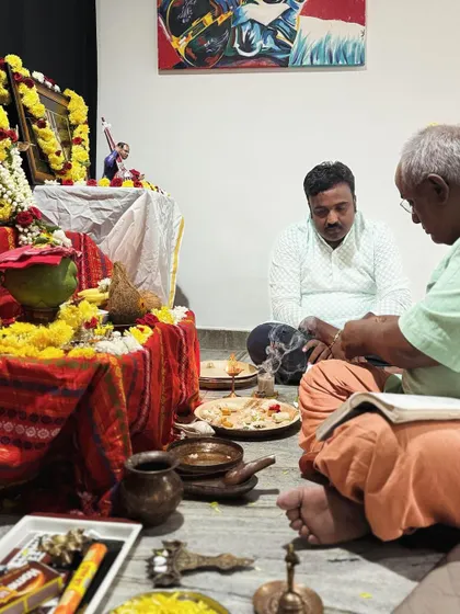 A moment of prayer during the Saraswati Pooja at my home, where many of our classes take place.