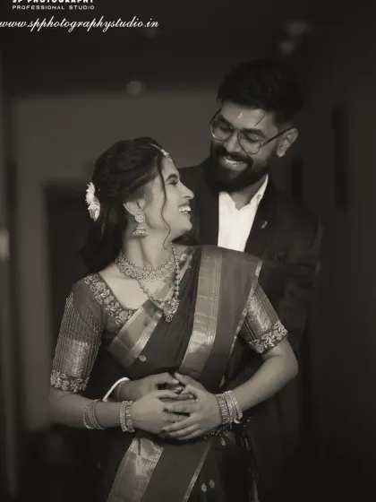 A joyful black and white portrait of the couple. Their bright smiles and the way they hold each other make this a timeless and happy memory.