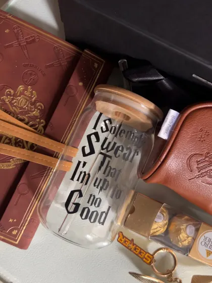 The "I Solemnly Swear That I'm Up To No Good" glass tumbler is a must-have for any fan, and a fun part of this themed hamper.