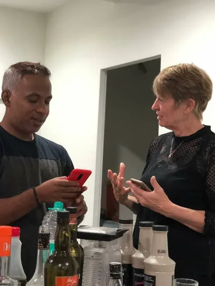 A candid moment of interaction with a guest at a private event. I enjoy discussing different flavor profiles and helping people discover their new favorite drink.