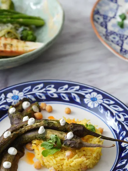 A creative eggplant dish served with saffron rice, showcasing the global inspiration behind my cooking.