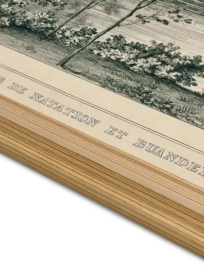 A close-up detail of a framed etching print. You can see the texture of the Canson archival rag paper and the clean lines of the solid wooden frame. Proper dry mounting is crucial, especially in humid climates, to prevent warping.