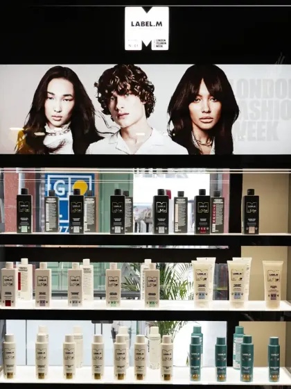 The sleek, fully stocked Label.M retail section in our salon. We teach our students not only how to use these products but also how to consult with clients and recommend the right at-home care regimen.