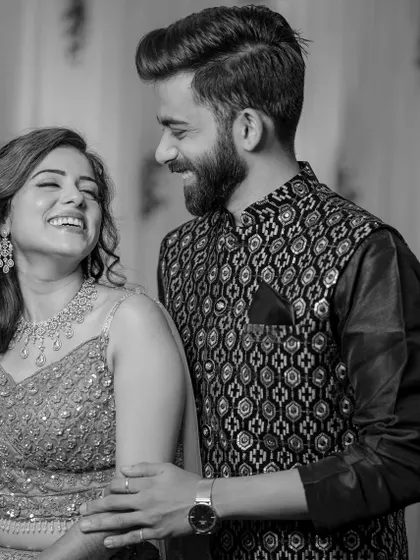 A beautiful black and white shot of Manali and her partner, her smile and happiness shining through.