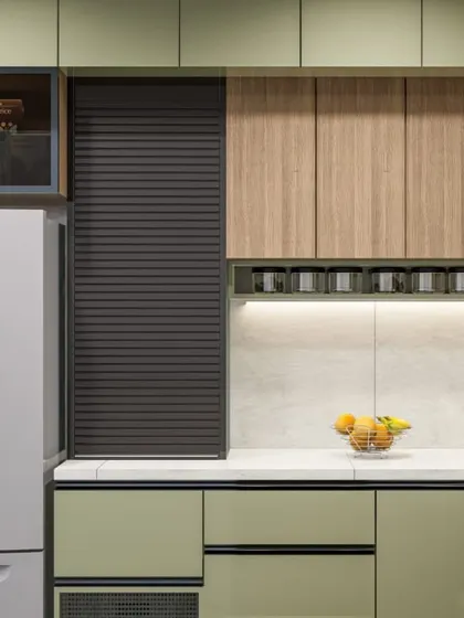 We specialize in smart storage solutions for a clutter-free kitchen. This design incorporates a rolling shutter cabinet, also known as an appliance garage, to neatly conceal countertop appliances like a toaster or coffee maker when not in use, maintaining a clean and organized look.