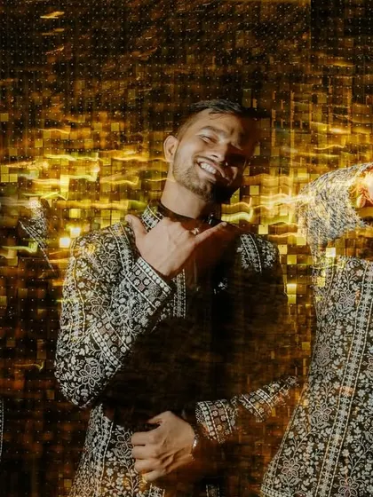A creative multiple-exposure shot of the groom. This technique captures his different poses and expressions in one frame, creating a cool, abstract portrait.