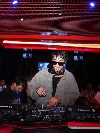 Performing at Sunburn Union in Bangalore. The red cage-like DJ booth adds to the unique, industrial vibe of the party.