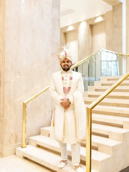 A full length portrait of the groom, Aakash. The marble and gold interiors of the hotel perfectly complemented his elegant wedding attire.