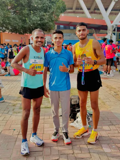 Our athletes connecting with other runners at an event. It's a community that extends beyond just our own group.