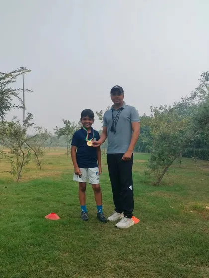 Posing with a proud student and his medal after a successful competition. My youth sports coaching is designed to build both skill and confidence.
