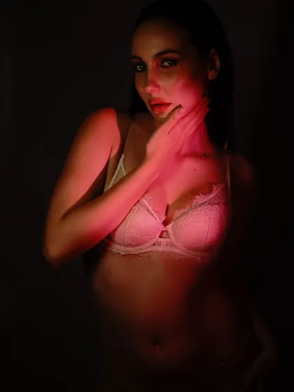 A darker, more intimate portrait from the same series. The light just kisses the model's skin, leaving much to the imagination.