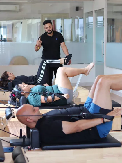 I believe in quality over quantity, which is why my classes have a maximum of five people. This image captures a typical small group session, where I can provide personalized guidance and hands-on adjustments to ensure everyone is moving safely and effectively.