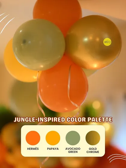A jungle-inspired color palette for a "Wild One" first birthday. We used shades of Hermes orange, papaya, avocado green, and gold chrome to create an adventurous and unique look.