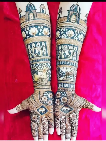 A classic Rajasthani theme with palace architecture at the top. The design includes swans, lotus flowers, and auspicious symbols like the swastika.
