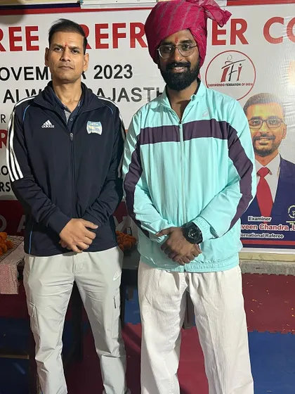 Pictured with an official at the National Referee Course in Alwar, Rajasthan. Collaboration with regional associations is key to promoting Taekwondo.