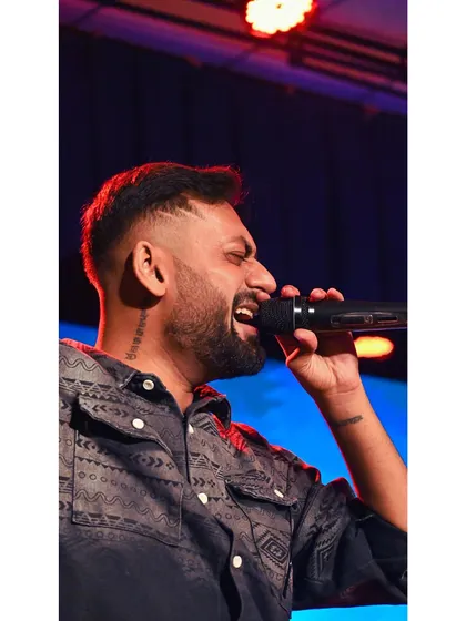 A close-up, high-energy shot of me performing at Expression 2025. You can see the passion and dedication I put into every word.