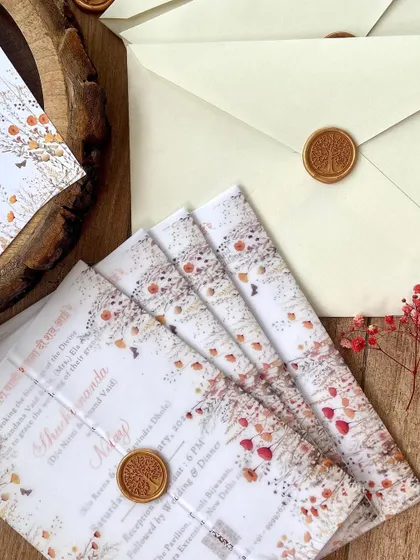 The crisp, clean look of vellum wraps and wax seals is a favorite of mine. For this suite, we used a tree of life wax seal to complement the wildflower and nature theme of the invitation design.
