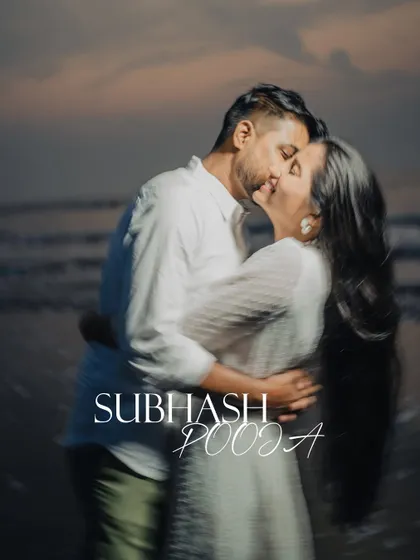 An artistic and romantic pre-wedding photo capturing the motion of a passionate kiss on the beach, with a beautiful blur effect that emphasizes the emotion.