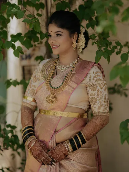 A full shot of Gagana looking radiant in her reception attire. The look is traditional yet fresh and modern.