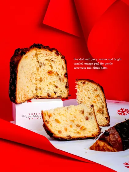 A slice of my Raisin & Candied Orange Panettone. This traditional Italian Christmas bread is buttery and cloud-like, studded with juicy raisins and citrusy candied orange peel.