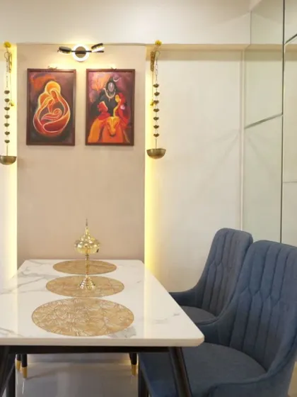 A close-up of the dining area in the Bagchi family's home, where modern art and traditional hanging diyas create a unique and personal ambiance.