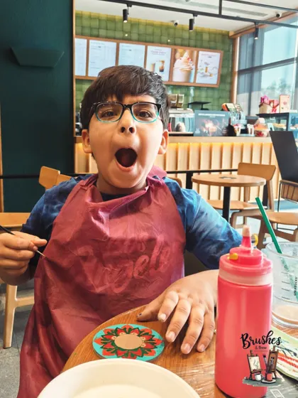 The cutest thing. A young boy's excited reaction during a workshop, a moment of pure, unfiltered joy.