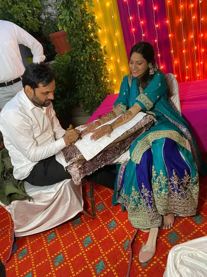 Another shot of me at a client's home, focused on creating the perfect bridal mehandi.