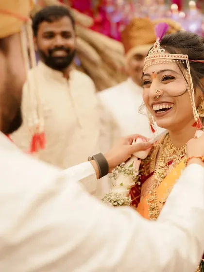 Laughter and joy are the best accessories. This bride's radiant smile is the centerpiece of her look, enhanced by a classic makeup application.