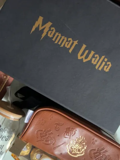 The hamper box is personalized with the recipient's name in the iconic Harry Potter font, making it feel like a delivery from Hogwarts itself.